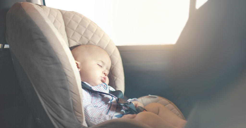 baby sleeping in car